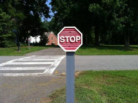From Rene S: mini stop sign on a walking path! 