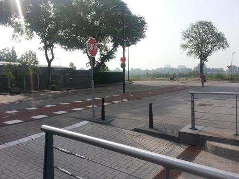 From Ine in the Netherlands: These were taken right outside the headquarters of Shell (the oil company) in Amsterdam. I work just around the corner. There aren’t that many stop signs in the Netherlands anymore I think. Most of the streets near my house have traffic lights. Maybe they thought people weren’t paying enough attention to signs. The word “Stop” is the same in Dutch (the language we speak in the Netherlands) as in English.